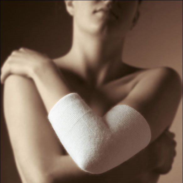 Armbågsvärmare i angora – Konstant värme och hög elasticitet