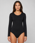 Bodystocking med lång ärm och tryckknappar, tillverkad av bomull och lycra, finns i grön, vit, svart, bordeaux.