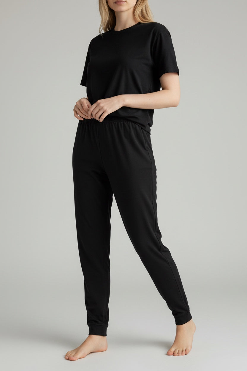 Care Design black cotton-lycra adult pants with high waist and ankle cuffs, designed for comfort with or without diapers.