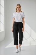 Care Design black 3/4 length capri pants with elastic waist and side zippers.