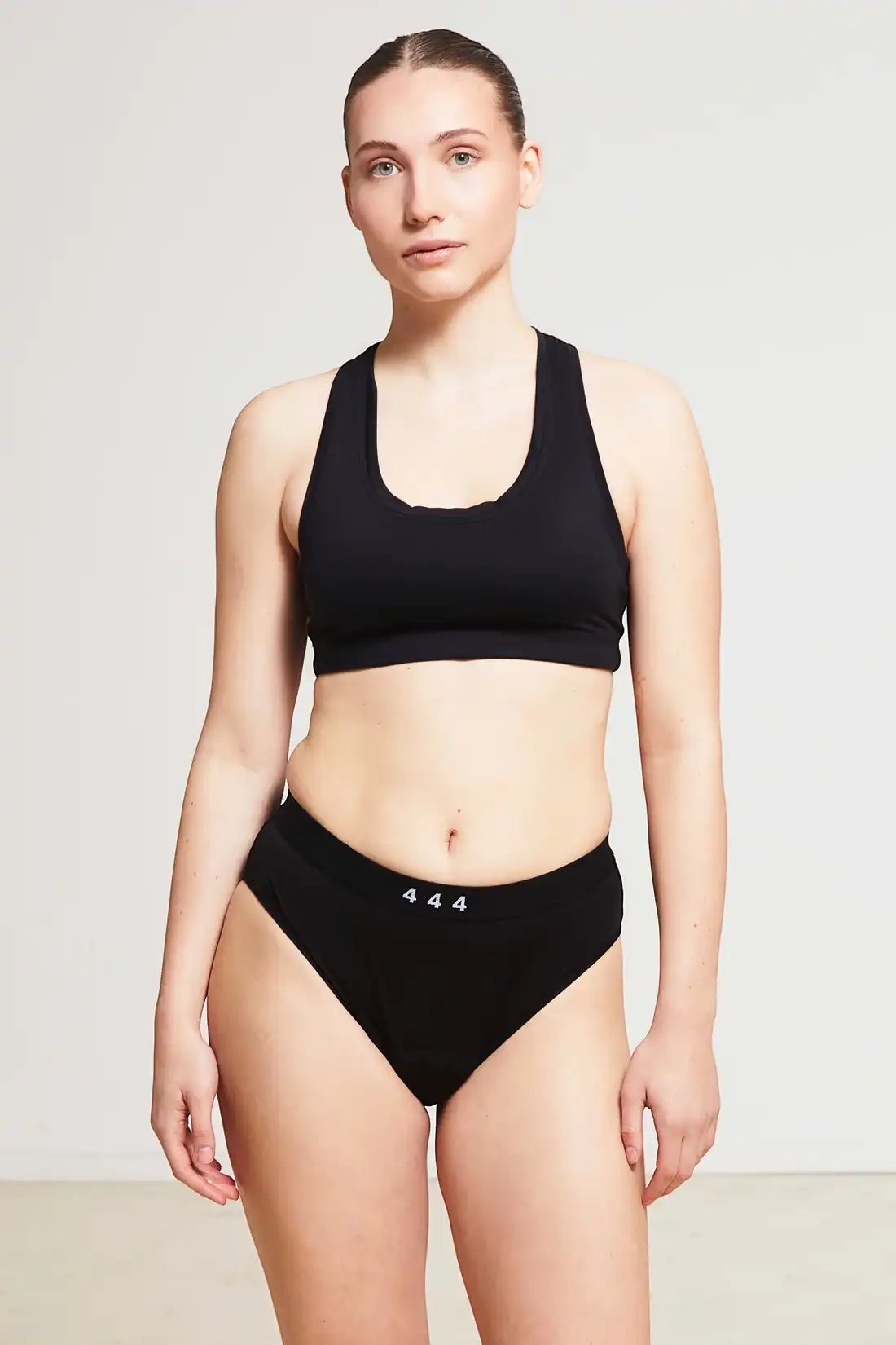 Care Design black low-waist incontinence panties with built-in absorbent barrier, made from OEKO-TEX certified nylon and spandex blend.