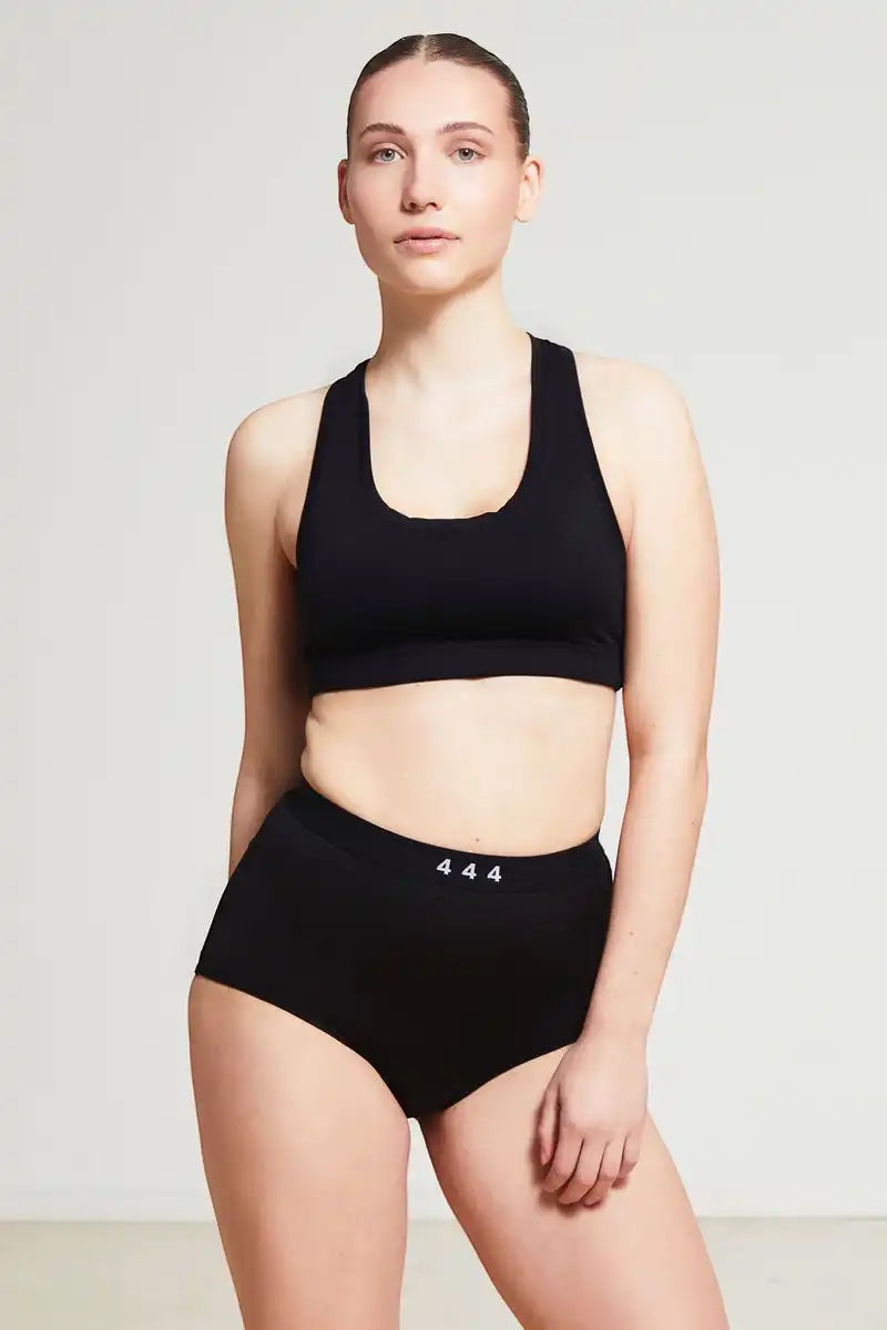 Care Design black high-waisted incontinence underwear with built-in barrier, 4-layer absorbent gusset, OEKO-TEX certified.