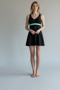 Care Design black "Paris" swimsuit with a mint green band and skirt for women with stoma. V-neck, sleeveless.