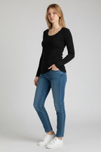 Care Design black 100% wool long-sleeve top with lace trim at neckline and cuffs.