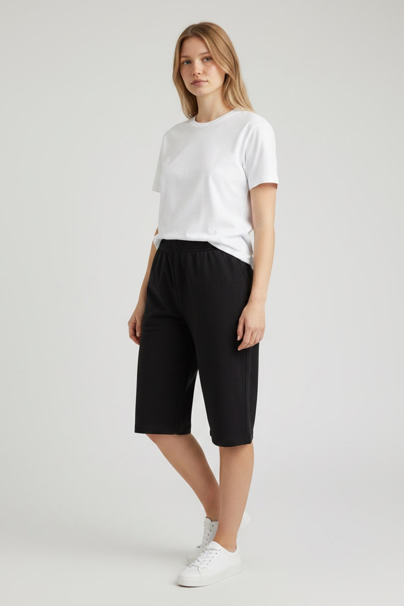 Care Design black athletic shorts with side zippers and elastic waistband.
