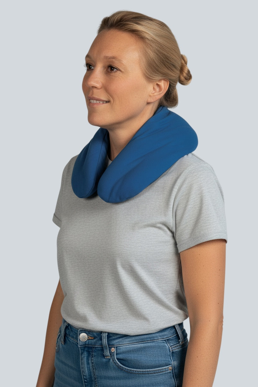 Care Design blue organic neck pillow for microwave or oven, filled with triticale, chamomile, and lavender for pain relief.