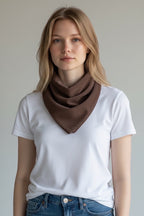 Care Design brown corduroy bandana bib with snap closure, 4 absorbent layers, 3 sizes available.