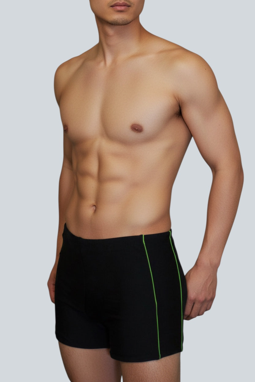 Care Design Florida black men's swim trunks with green side stripe, high waist, and inner pocket for stoma bag.