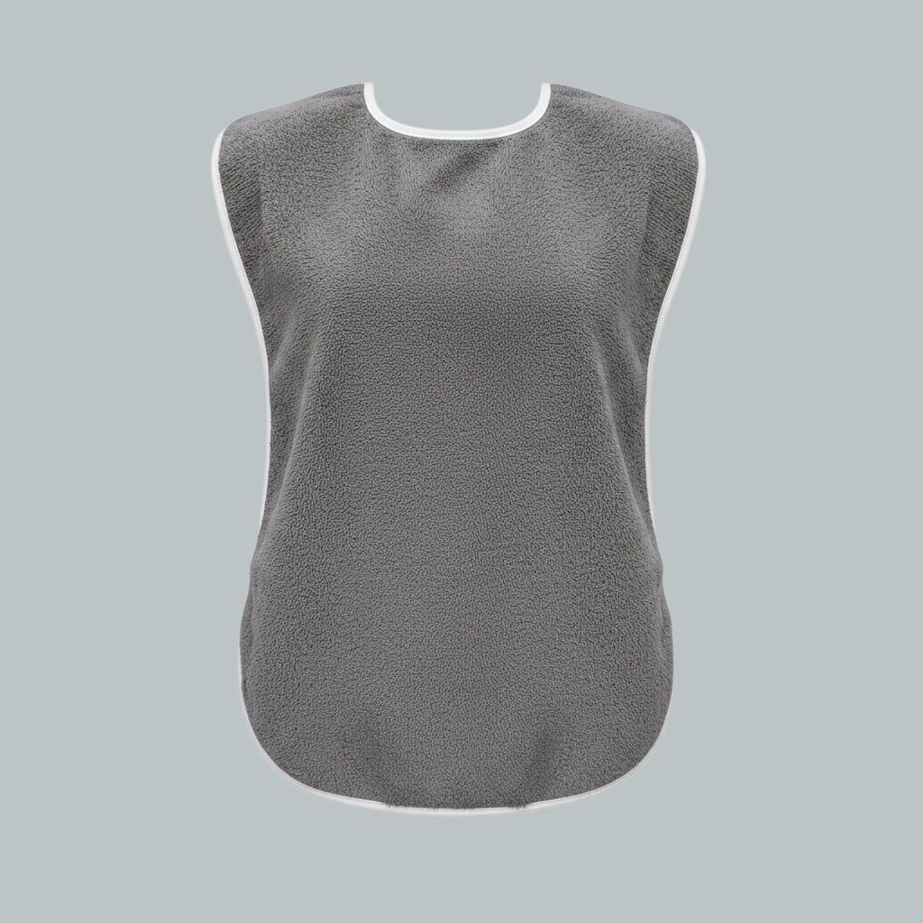 Care Design grey adult bib made of absorbent cotton terry with waterproof polyurethane backing. Features snap closure.