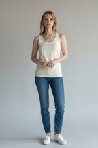 Care Design "Marie" women's ivory 100% wool tank top. Facon-cut with a scoop neck, perfect for warmth and breathability.
