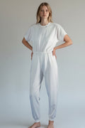 Care Design white 100% cotton short-sleeve adult bodystocking with long legs and zipper closure.