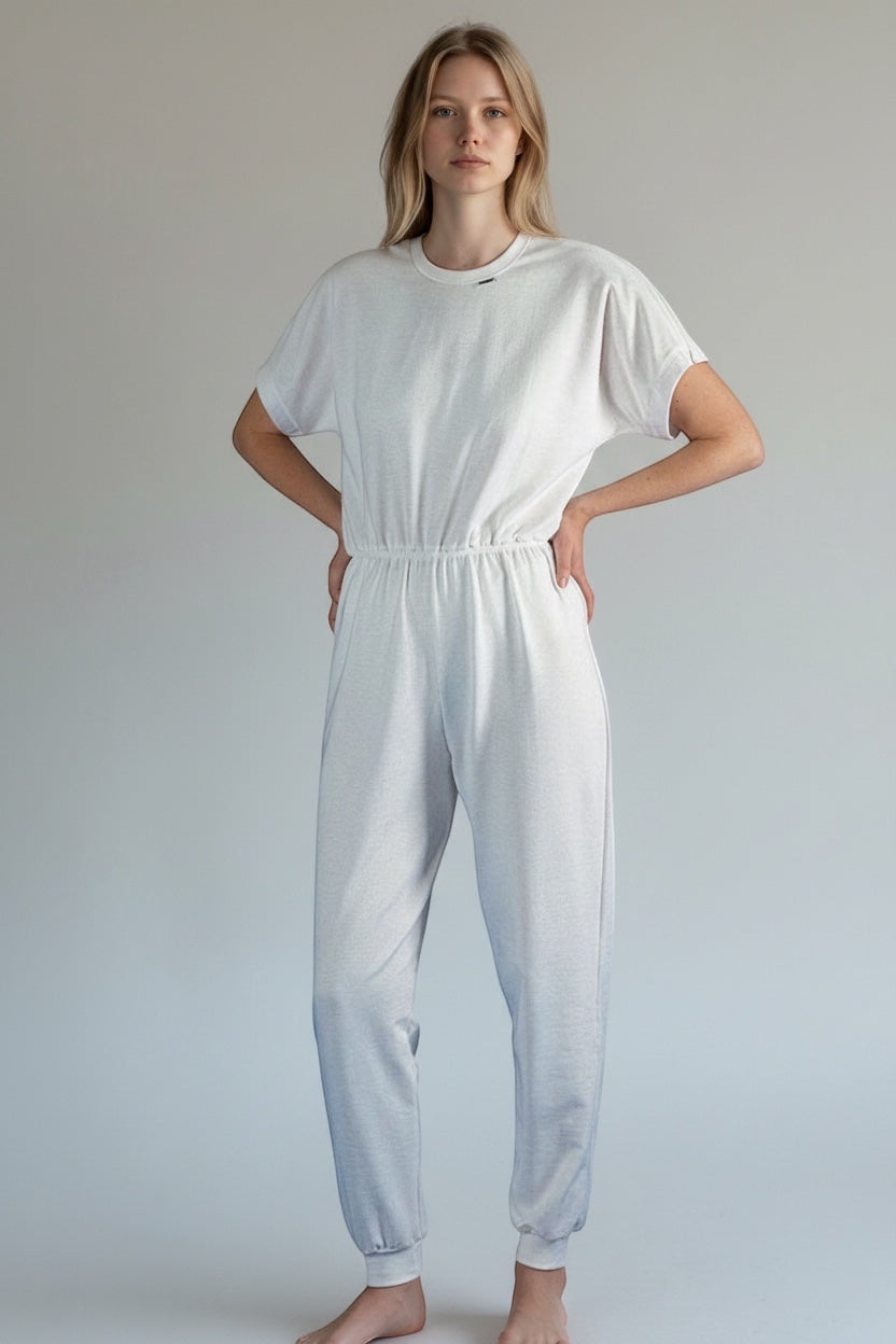 Care Design white 100% cotton short-sleeve adult bodystocking with long legs and zipper closure.