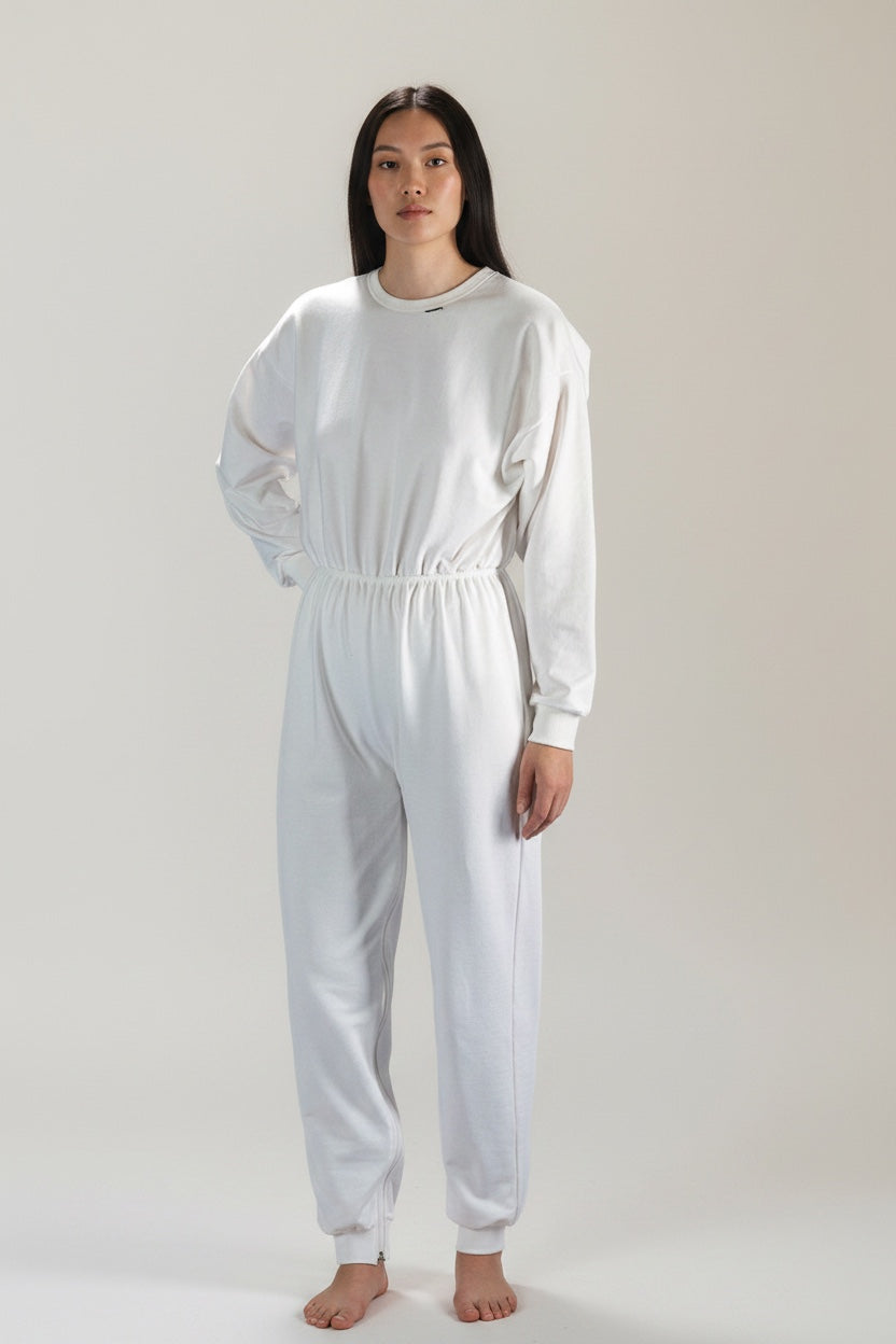 Care Design white cotton long-sleeved, long-legged bodystocking with ankle-to-ankle zipper and elastic waist.