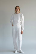 Care Design white long-sleeved, long-legged bodystocking made from 100% Oeko-Tex certified cotton.