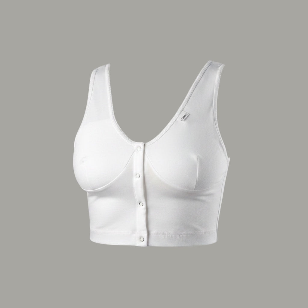 Care Design white cotton blend bra with front snap closure, wide straps, and supportive band for large busts and sensitive skin.