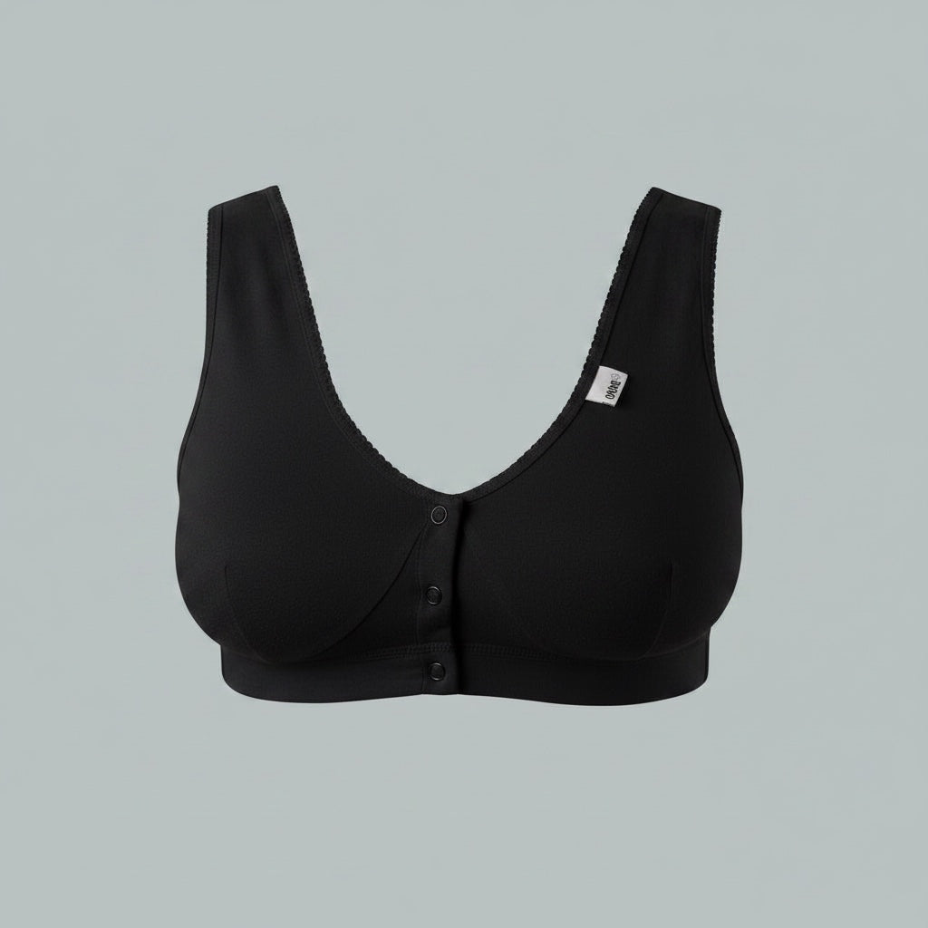 Care Design white cotton-lycra support bra with front button closure, wide straps, and comfortable fit for large busts and sensitive skin.