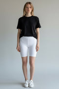 Care Design white unisex hip protection shorts with built-in pockets for hip shells, designed for fall prevention and osteoporosis.
