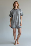 Care Design grey marl jogging fabric short sleeve bodysuit with zip back and button neck, size M.
