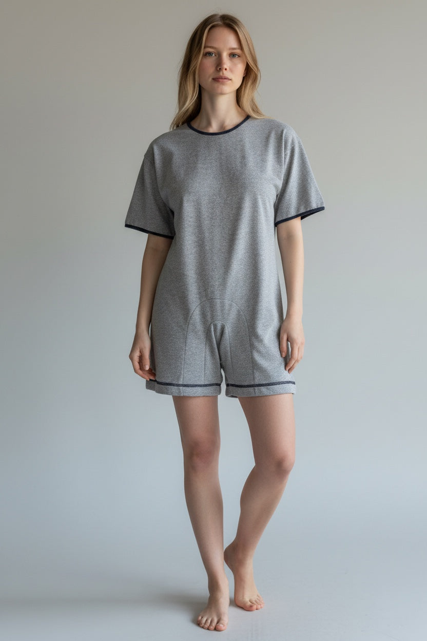 Care Design grey marl jogging fabric short sleeve bodysuit with zip back and button neck, size M.