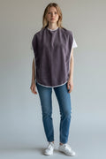 Care Design purple microfiber adult bib with white trim. Waterproof membrane protects clothing during meals.