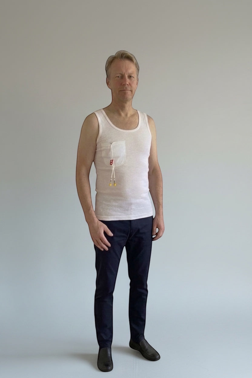 Care Design white 100% cotton tank top with a discreet pocket for central venous catheter tubing. Unisex design.
